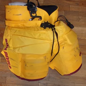 ARIZONA STATE hockey game-worn gold CCM goalie pants worn by TJ Semptimfelter (2022-24)