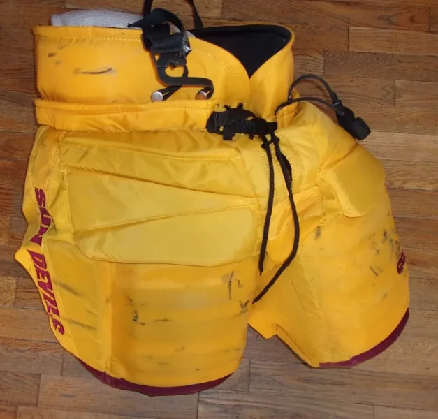 ARIZONA STATE hockey game-worn gold CCM goalie pants worn by TJ Semptimfelter (2022-24)