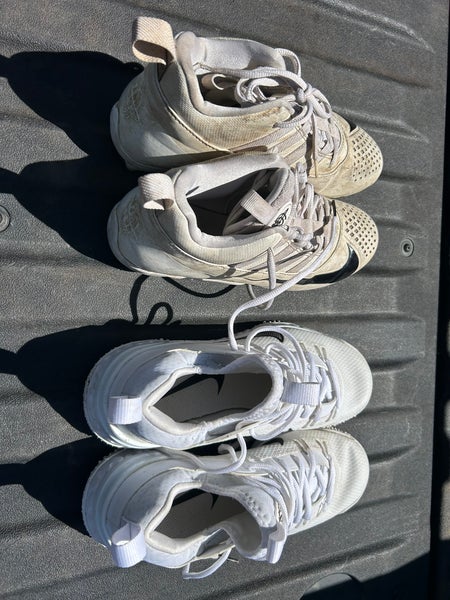 2 pair white Nike Unisex Size M 7.0 (W 8.0) Youth Mid Top Molded Cleats (Used)