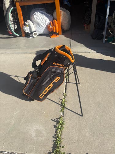 Jr Golf Bag: Cobra King Junior Youth Stand Golf Bag in black and orange