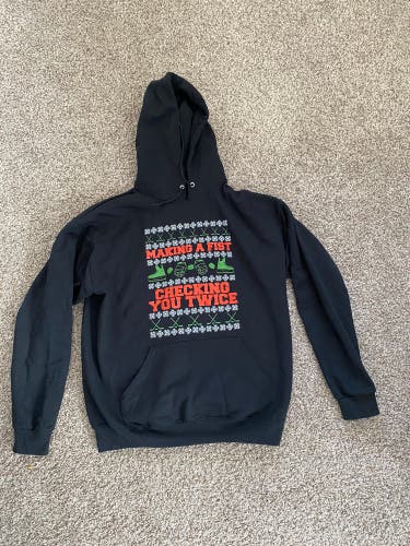 Making a fist and checking you twice Hoodie