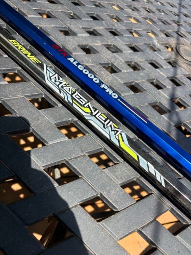 Two (2) Used Lacrosse Shafts — Brine Magnum and STX AL6000 Pro