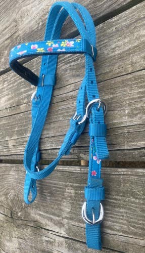 Lightly used nylon pony size Western headstall teal w/floral overlay