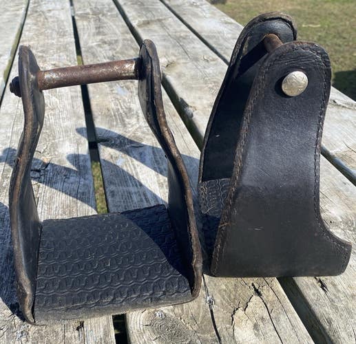 Used leather covered steel endurance / trail stirrups w/rubber tread