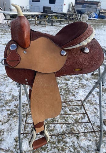 14” Western barrel saddle w/tooled skirts, roughout fenders, rawhide trim