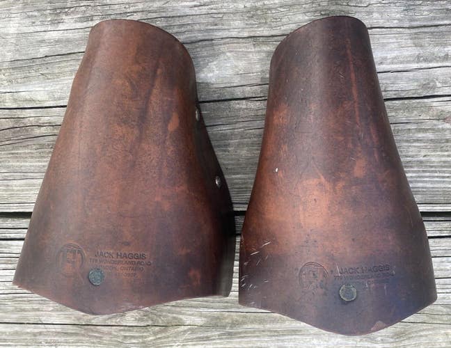 Used Jack Haggis hooded Tucker style military/ Western stirrups made in Canada
