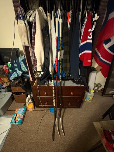 Three composite hockey sticks