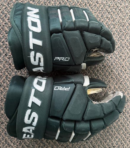 USED GREEN AND WHITE  EASTON 15 GLOVES