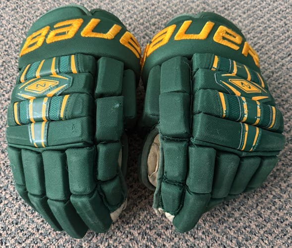 USED GREEN AND  YELLOW BAUER NEXUS 15 GLOVES