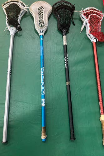 Four complete lacrosse sticks 
Adult Sticks  (Used)