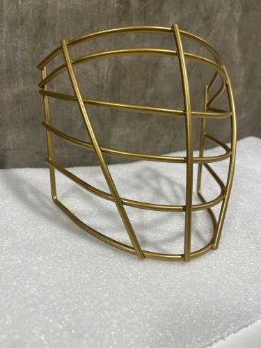 NLL style box lacrosse face mask. (Gold)