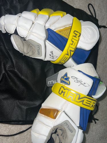Signed by Lyle and Miles Thompson and pole Game Worn Florida Launch MLL gloves