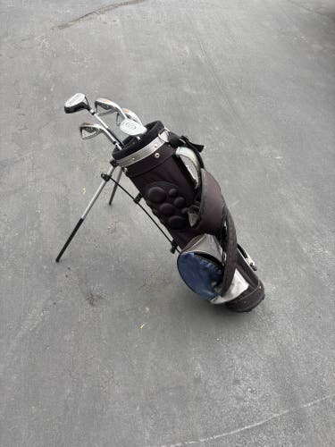 Full golf bag with clubs