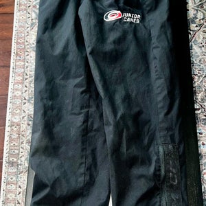 Junior Canes - Black Medium Kids Unisex CCM Warm-Up Pants (Used)