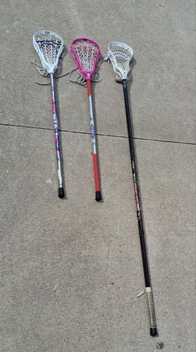 Bundle of 1 Warrior defense stick and 2 STX player sticks (Used)
