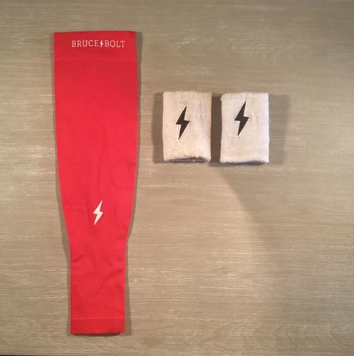 Red XL Bruce bolt arm sleeve and 2 white Bruce bolt wrist bans!