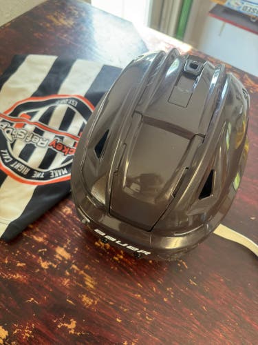 Bruins brown pro stock Large Bauer Re-Akt 150 Helmet Pro Stock (Used)