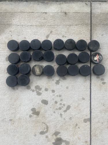 26 Used Hockey Pucks