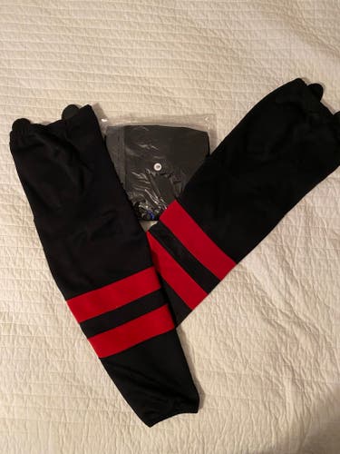 Two pair (28" used & 30" new) Black with Red Stripe Hockey Socks