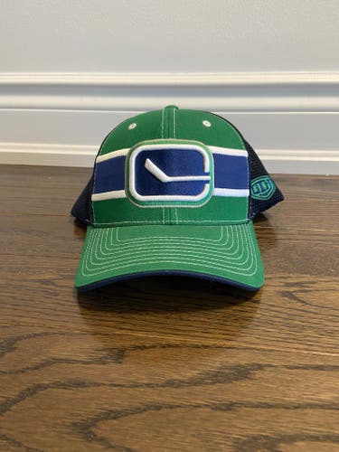 Vancouver Canucks Stick in Rink Flexfit hat