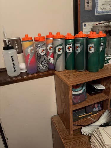 13 32 oz Gatorade water bottles (Used) 1 Bauer bottle