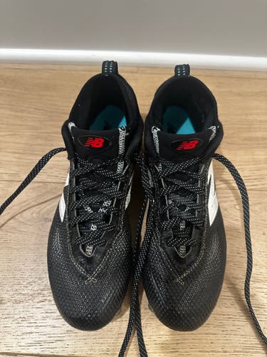 Black Unisex Size M 9.0 (W 10.0) Youth New Balance High Top Molded Cleats (Used)