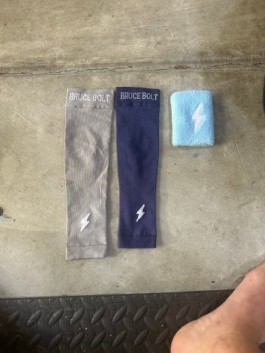 Pair of Bruce Bolt Youth Arm Sleeves (compression) and Bruce Bolt wrist band