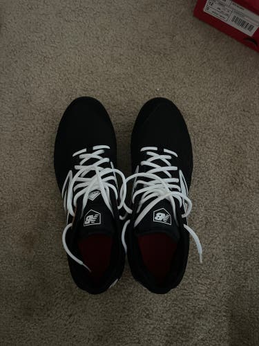 Black and white new balance cleats