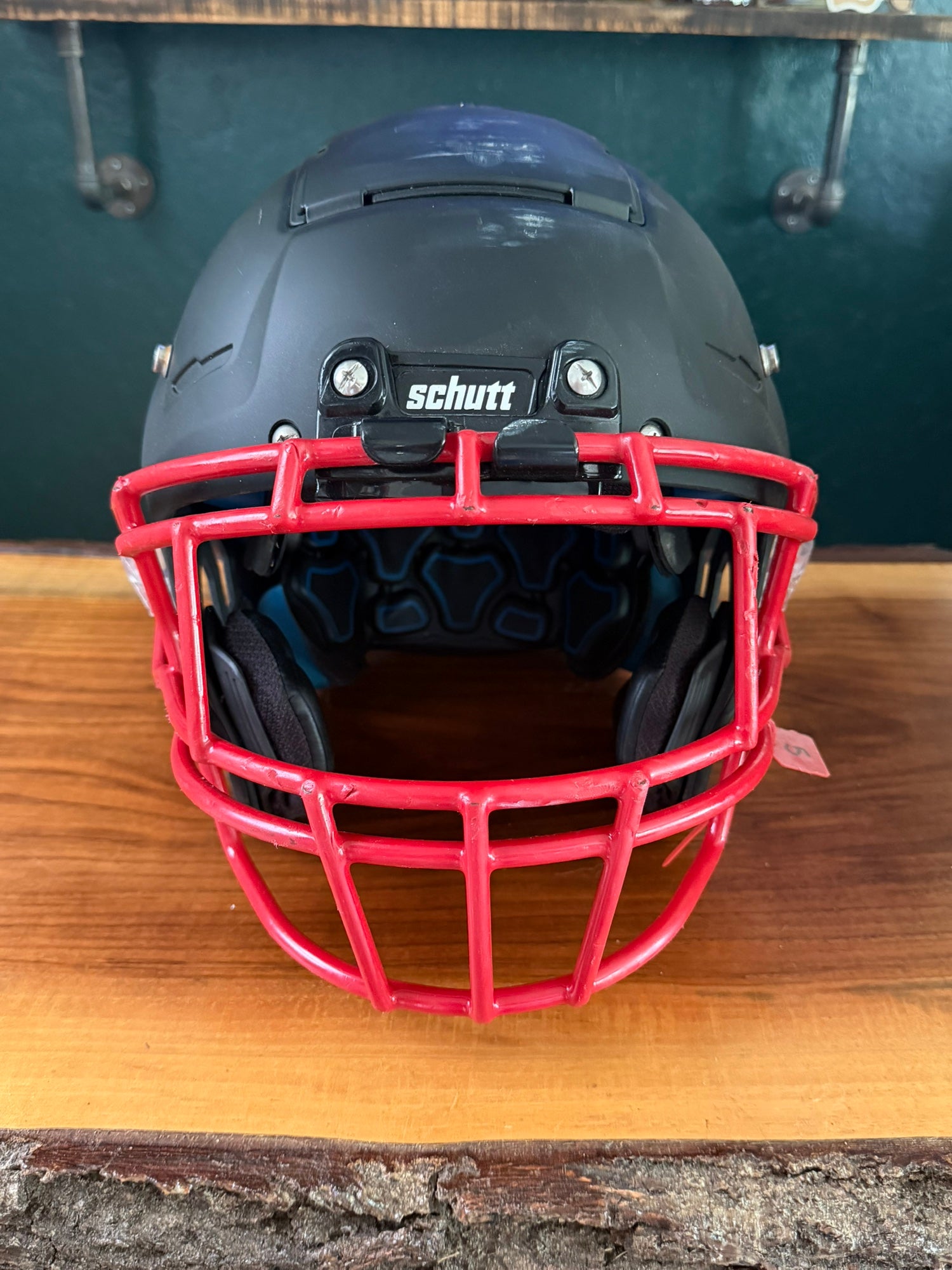 black football helmet with red face mask Riddell SpeedFlex SF-2BDC-TX-HD Facemask HD combines horizontal and diagonal bars for an aggressive look with plenty of facial protection 50+ Football Helmet Facemask Stock