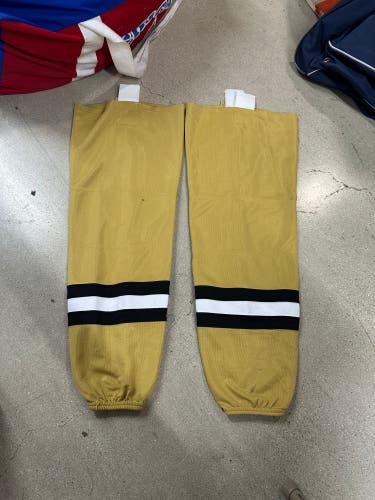 Game used Muskegon Lumber Jacks Gold Senior Large Socks Pro Stock (Used)