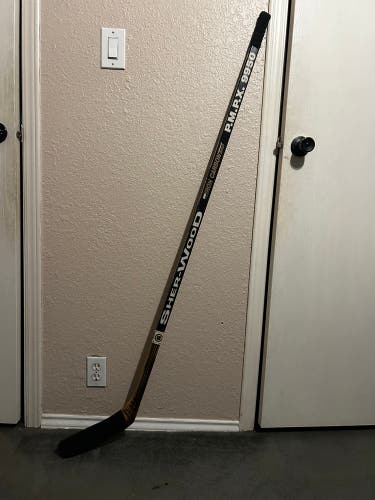 Game used and signed Adam Oates hockey stick