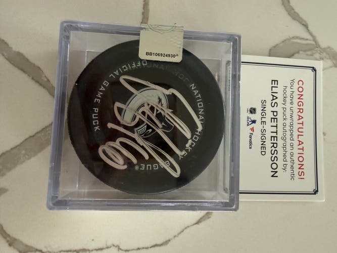 Elias Pettersson Autographed Game Used Puck