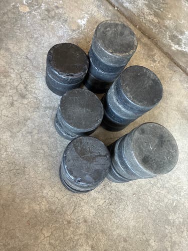 24 hockey pucks (Used)