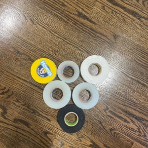 Hockey tape and wax box comes with 3 clear tapes, 1 black tape, 1 white tape, and one Howies wax.