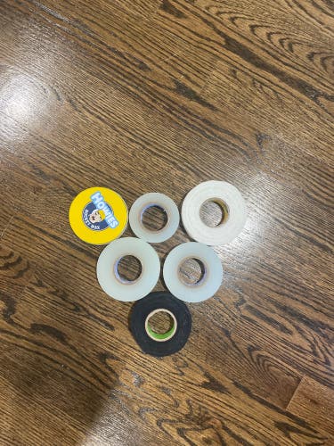 Hockey tape and wax box comes with 3 clear tapes, 1 black tape, 1 white tape, and one Howies wax.