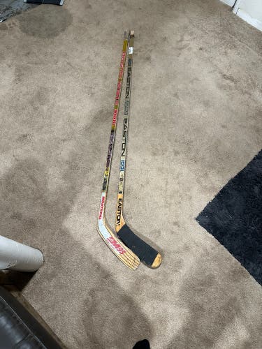 Two Vintage Easton Right Handed Hockey Sticks