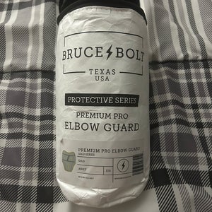 Brand new Gold Brucebolt elbow guard