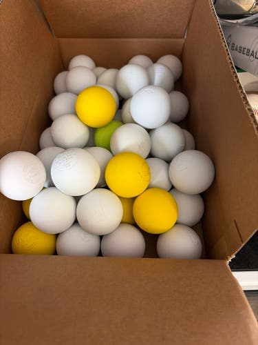 36 Pack of lightly used and new Assorted white and yellow lacrosse balls.