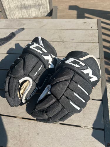 Black CCM Tacks 4 Roll Pro 2 Gloves 14"