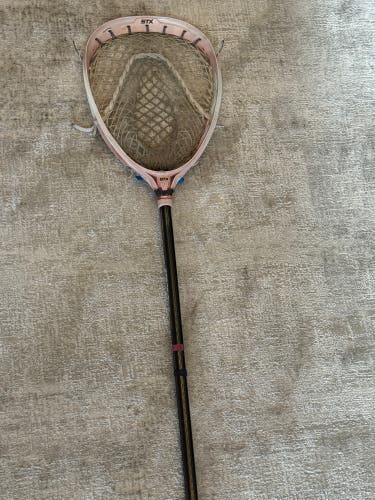 STX Eclipse goalie head strung with throne mesh on a gate ice shaft