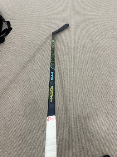 Alex DeBrincat stick from the red wings signed