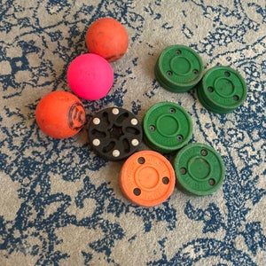 (Used)Green Biscuit Hockey Training Pucks along with Hockey Training Balls
