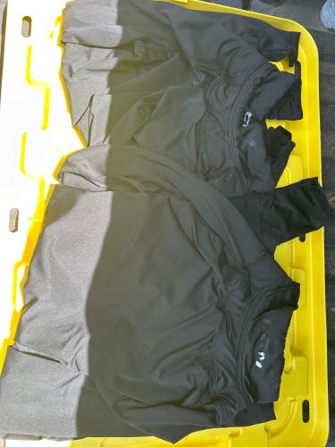 2 Men’s Small CCM (Used) neck guard shirts. Long sleeve