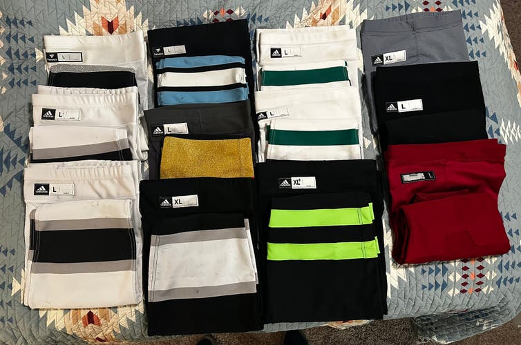 Assorted like new and used Adidas pro stock hockey socks.