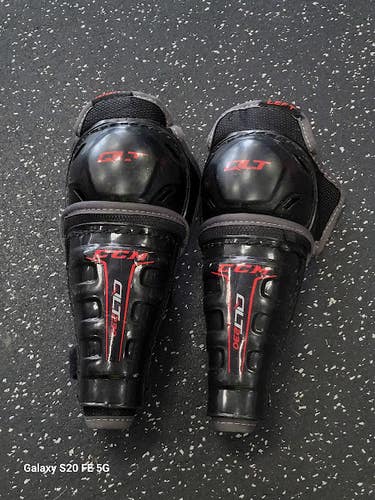 Used CCM QLT 230 Junior Shin Guards Black 8" 11849-S000042857