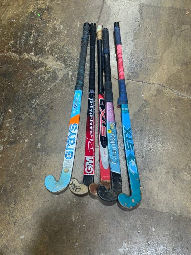 Five Used Field Hockey Sticks