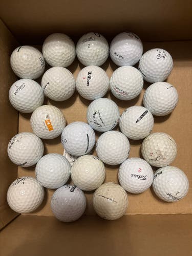 assorted used golf balls