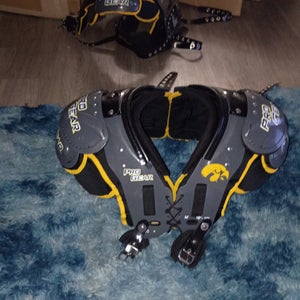 Team issued Iowa University college shoulder pads built in back plate