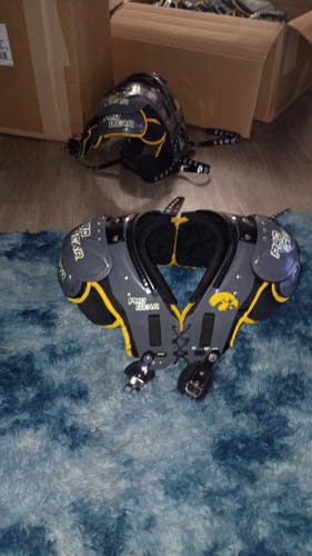 Team issued Iowa University college shoulder pads built in back plate