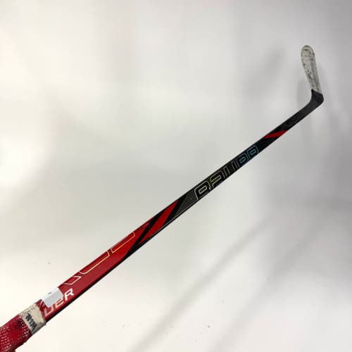 Used Left Red Bauer Nexus Tracer | 55 Flex P28 Curve Grip | AB699